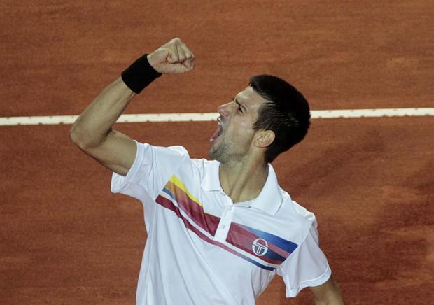 Serbia's Novak Djokovic celebrates at the end of the final match against Spain's Rafael Nadal at the Italian Open tennis tournament in Rome, Sunday, May 15, 2011. 
