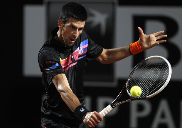 Serbia's Novak Djokovic returns the ball to Britain's Andy Murray 