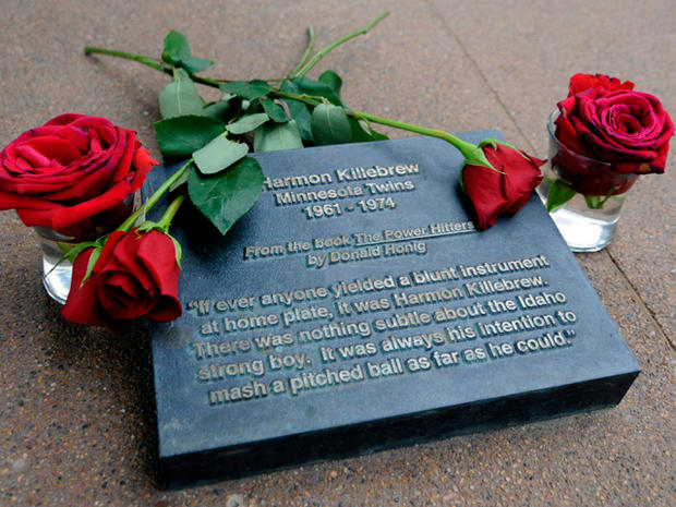 Roses sit on the plaque of Harmon Killebrew  