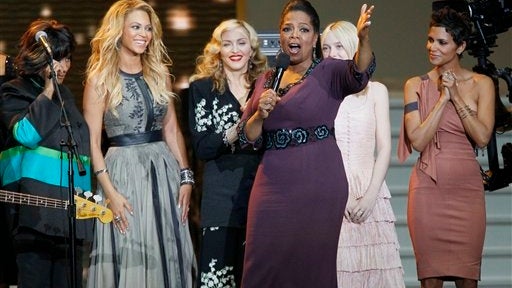 Oprah Winfrey speaks as she's surrounded by, from left, Patti LaBelle, Beyonc 