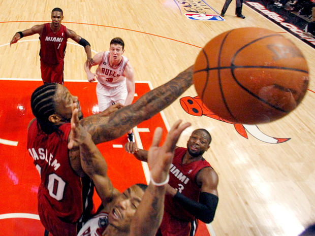 Udonis Haslem redirects the shot of Derrick Rose 