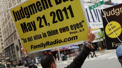 	NEW YORK, NY - MAY 13: Participants in a movement that is proselytizing that the world will end this May 21, Judgment Day, walk through the streets on May 13, 2011 in New York City. The Christian based movement, which claims thousands of supporters aroun 
