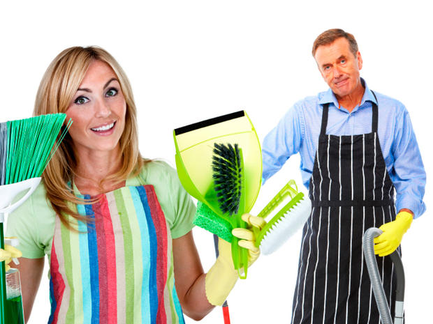 Woman holding cleaning products and man with a cleaning equipment 