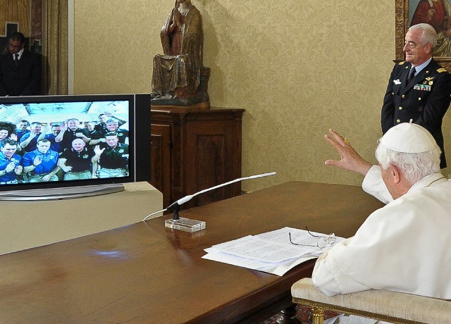 Image provided by NASA television shows space shuttle Endeavour's tiles being inspected early Saturday morning, using both the shuttle's robot arm and  an extension boom, tipped with lasers and cameras. 