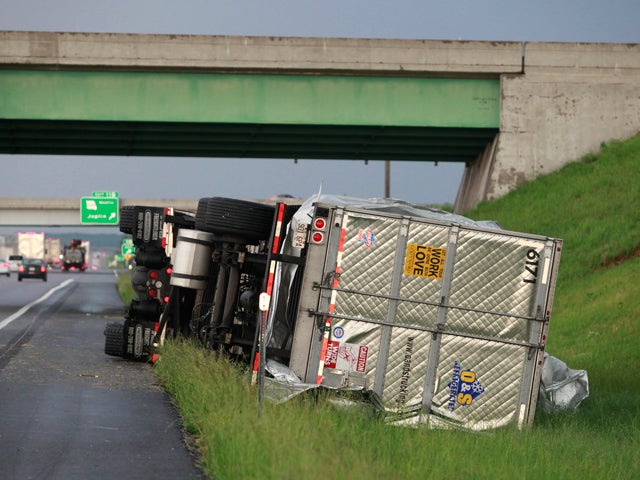 A tractor trailer is tipped 