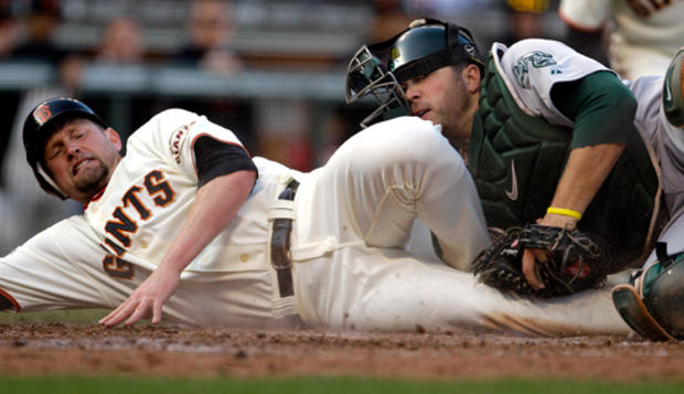 Aubrey Huff  is tagged out at home 