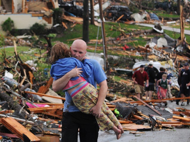 man carries a young girl 