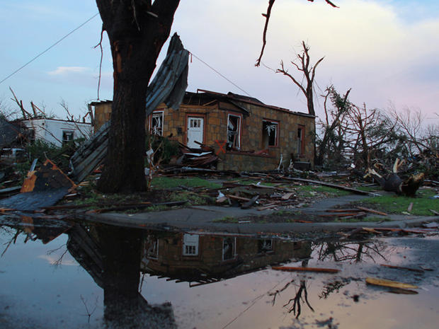 destroyed home is seen after a massive tornado 