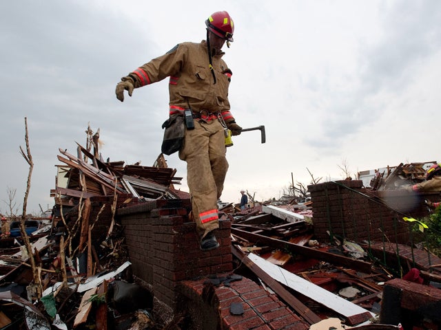 Rescue Team looks house-to-house to look for survivors 