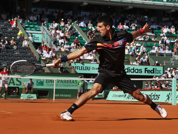 Novak Djokovic returns a shot 