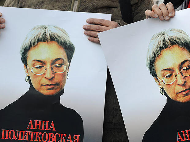 Russian human rights activists attend a rally in honour of slain Russian journalist Anna Politkovskaya in Moscow on October 7, 2010.  