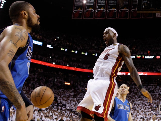 LeBron James reacts after dunking 