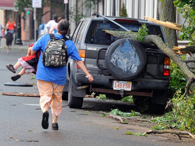 woman runs with her child to safety 