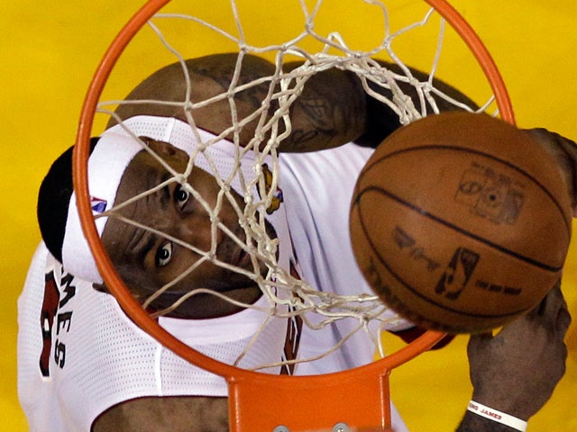 LeBron James watches his shot  