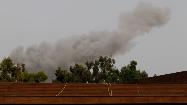 Smoke rises over Tripoli after a NATO airstrike 