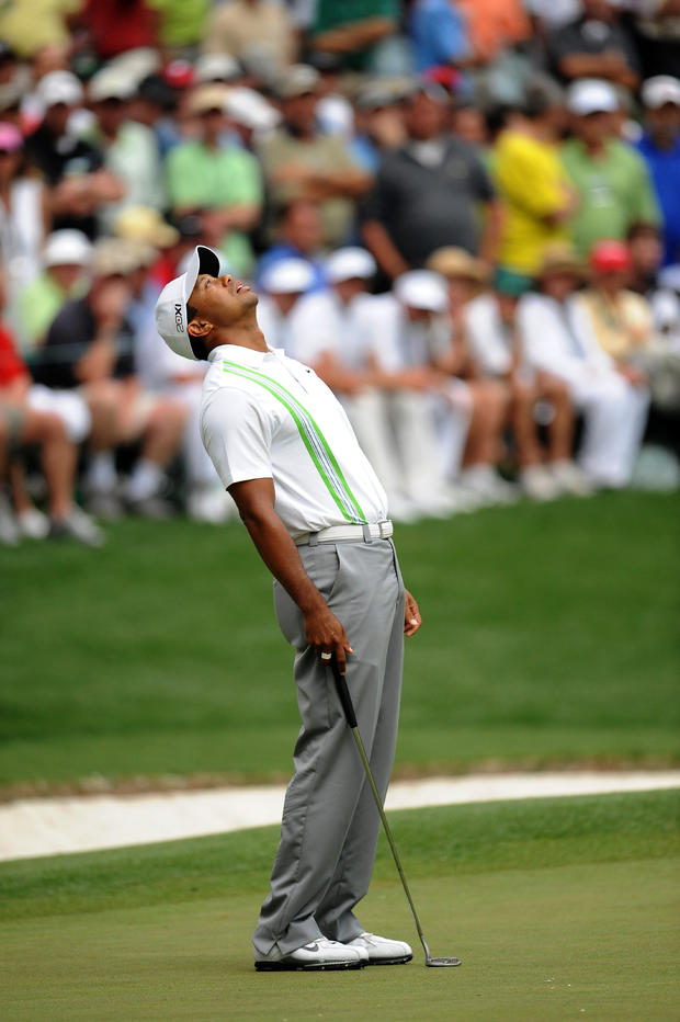 Tiger Woods of the US reacts to missing 