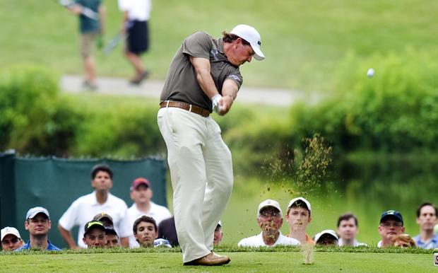 Phil Mickelson of the United States tees 