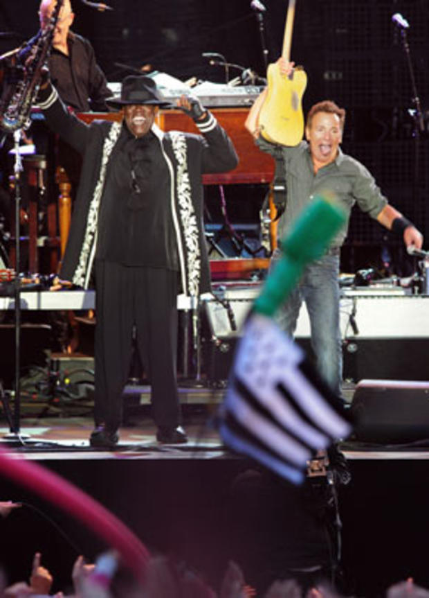 Bruce Springsteen and saxophonist Clarence Clemons perform on stage with the E-Street band, on July 16, 2009, in Carhaix-Plouguer, France 
