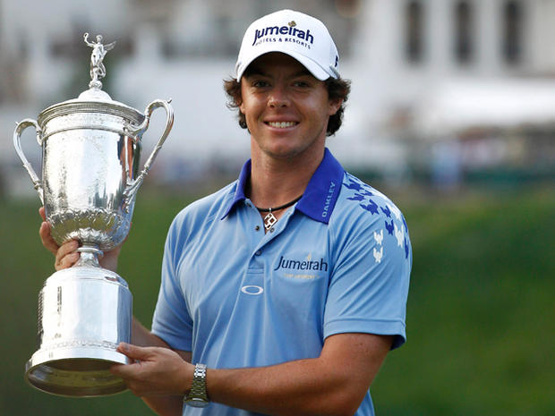 Rory McIlroy, of Northern Ireland, poses with the trophy after winning the U.S. Open Championship golf tournament  
