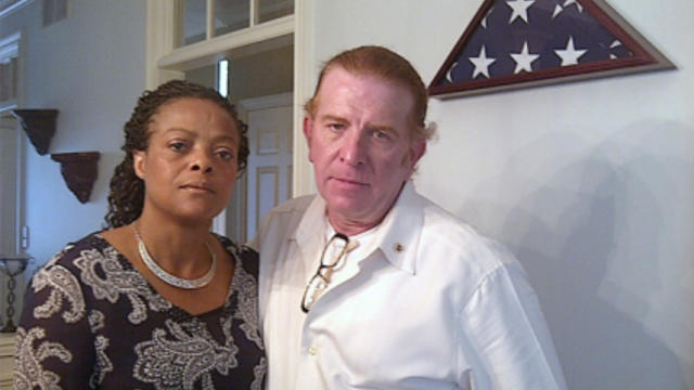  Gregg and Jannett Keesling at their home in Indianapolis. Behind them is an empty spot on a memorial wall for their son, Chance, where they'd planned to display a presidential condolence letter. They haven't received one. 