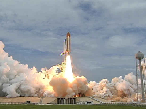 Space Shuttle Atlantis lifts off on NASA's final shuttle mission. 