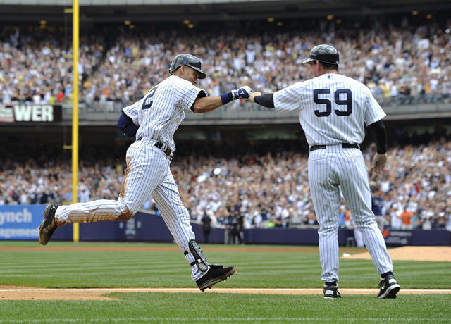 American League's Derek Jeter (R) watches as teammate Robinson Cano takes  some swings during batting practice before the 2014 MLB All Star Game at  Target Field on July 15, 2014 in Minneapolis.