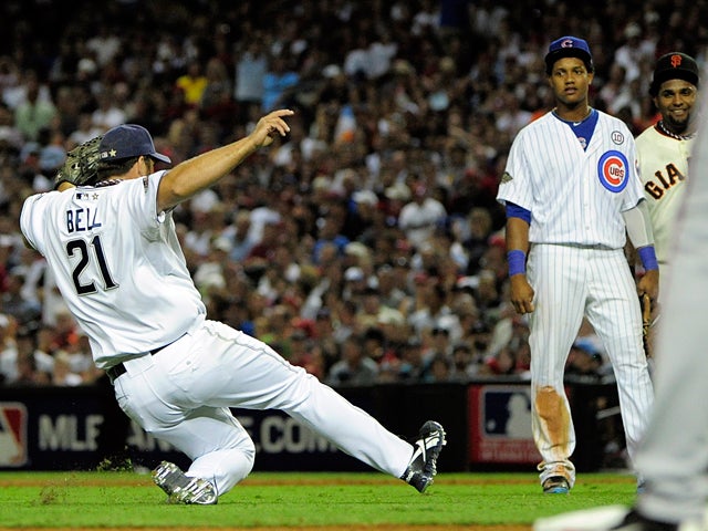 Heath Bell slides into the infield before pitching  