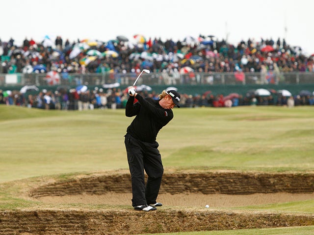 Miguel Angel Jimenez plays a shot 