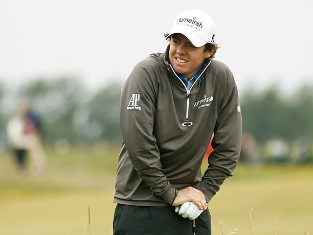 Rory McIlroy stands in the rough on the 15th hole 