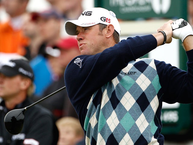 Lee Westwood hits a shot off the 4th tee 