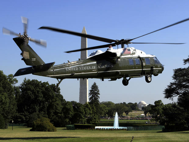 The Marine One helicopter carrying President Obama takes off from the South Lawn of the White House in Washington July 1, 2011, for Camp David, Md. The Washington Monument is at left, and the Jefferson Memorial is at center. 