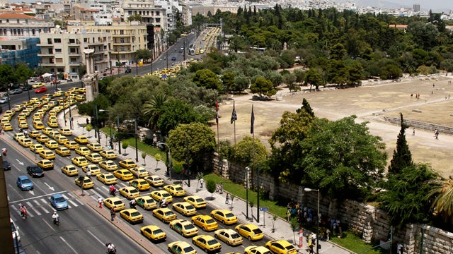 Striking taxi drivers block central streets in Athens, Greece, during a protest July 18, 2011. Taxi drivers are angry at plans to liberalize their tightly regulated profession as part of the country's fiscal recovery program that has already spurred month 