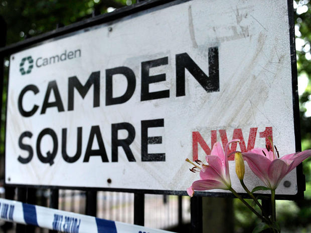 A flower is placed by a road sign near the north London flat in where the body of 27-year-old English pop star Amy Winehouse was found on July 23, 2011. 