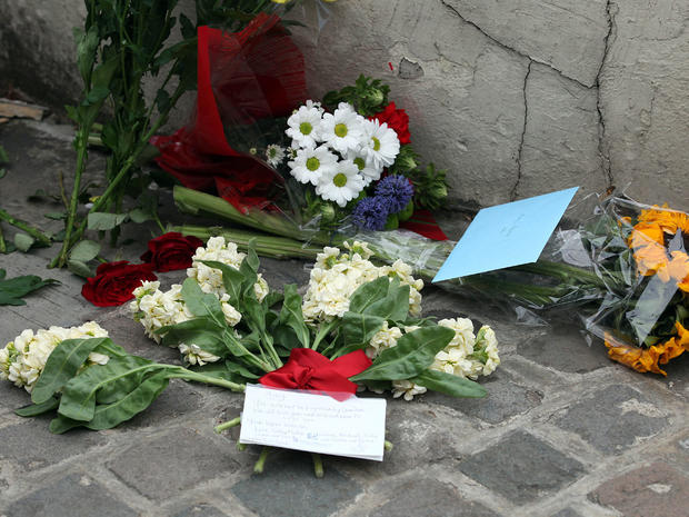 Floral tributes are left outside Amy Winehouse's North London home on July 23, 2011 in London, England. 