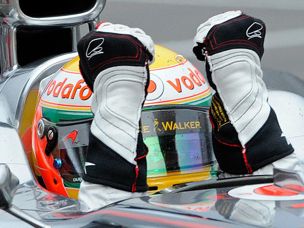 Lewis Hamilton celebrates as he crosses the finish line  