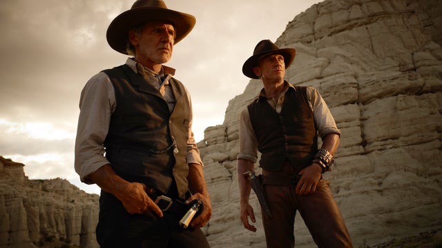 blicity image released by Universal Pictures, Harrison Ford, left, and Daniel Craig are shown in a scene from "Cowboys & Aliens." 