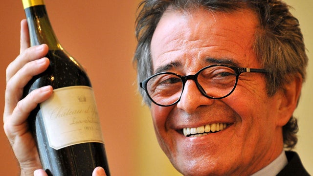 French private collector Christian Vanneque holds the bottle of 1811 Ch 