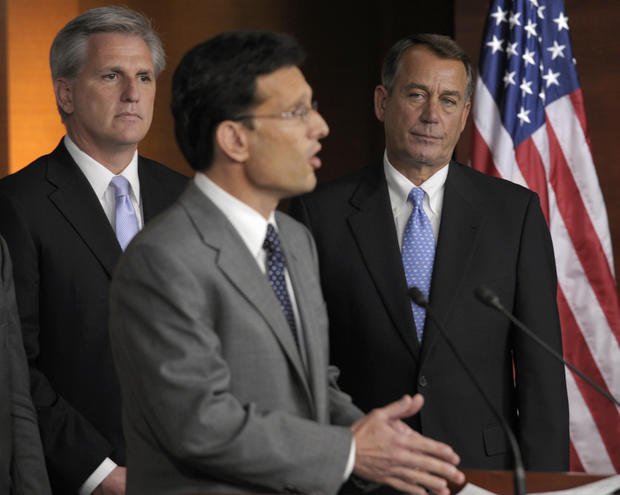 House Speaker John Boehner of Ohio, right, and House Majority Whip Kevin McCarthy of Calif., left, listen as House Majority Leader Eric Cantor of Va., center, speaks during a news conference on Capitol Hill in Washington, Thursday, July 28, 2011. 