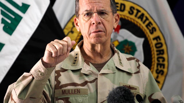 Adm. Mike Mullen, chairman of the Joint Chiefs of Staff, speaks to reporters at a news conference in Baghdad Aug. 2, 2011. The top U.S. military officer says American troops must be given protection from legal prosecution as part of any agreement to keep  