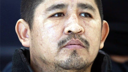 Moises Montero, aka 'The Korean', suspected of being the leader of the ' Independent' drug cartel of Acapulco, looks on during his presentation to the media in Mexico City, Tuesday, Aug. 2, 2011. Montero is also suspected in the kidnapping and killing of  