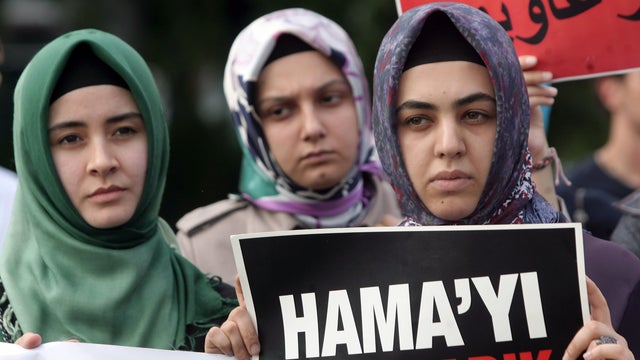 Members of a pro-Islamic human rights group and Syrians 