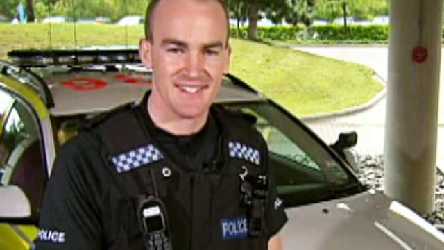 British Constable (police officer) Dan Pascoe was thrown in the air when his car was hit by a stolen car, but he managed to get up, chase, then taser the suspect, who was arrested. 