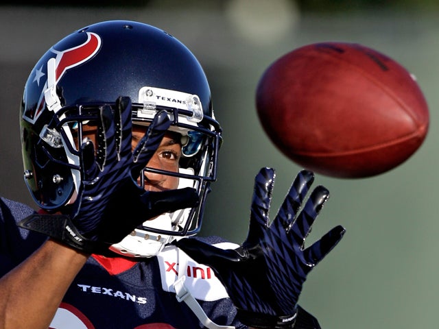 Brandon Harris catches a football  