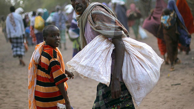 of food aid in the eastern Kenyan village of Hagadera near Dadaab, 60 miles from the Somali border, Sunday Aug. 7, 2011.  