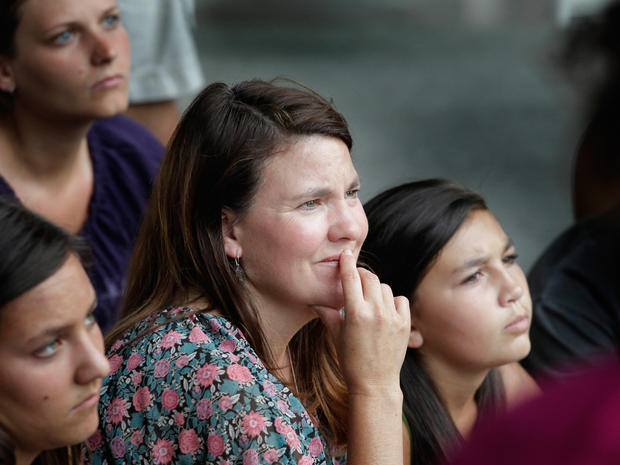 Tourists listen to a tour guide's memories of Sept. 11, 2001 in New York on July 28, 2011.  