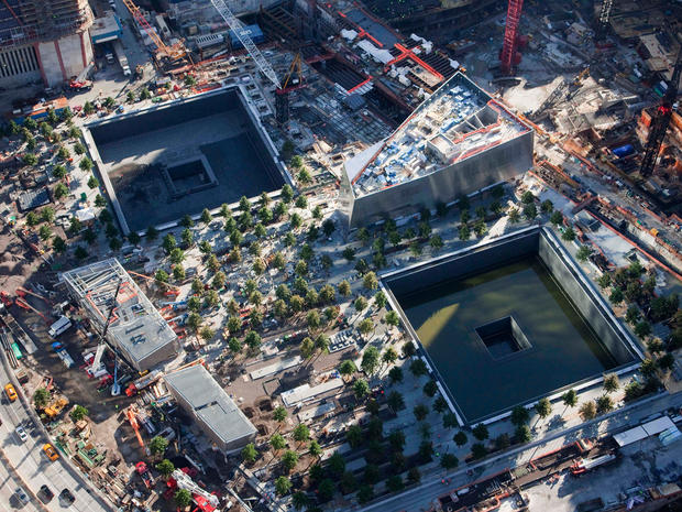 In this aerial photo of July 28, 2011, a grove of trees surround massive square reflecting pools at the National September 11 Memorial in New York. 