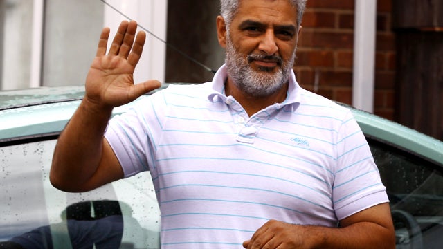 Tariq Jahan, father of one of the men killed by a vehicle in the Dudley Road neighborhood of Birmingham, England, talks with reporters outside his home Aug. 11, 2011. Police are continuing to investigate after three people, reportedly trying to protect sh 