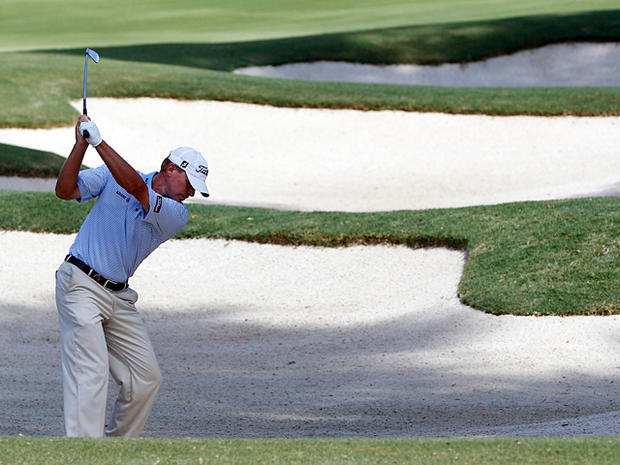 Steve Stricker hits out of a bunker  