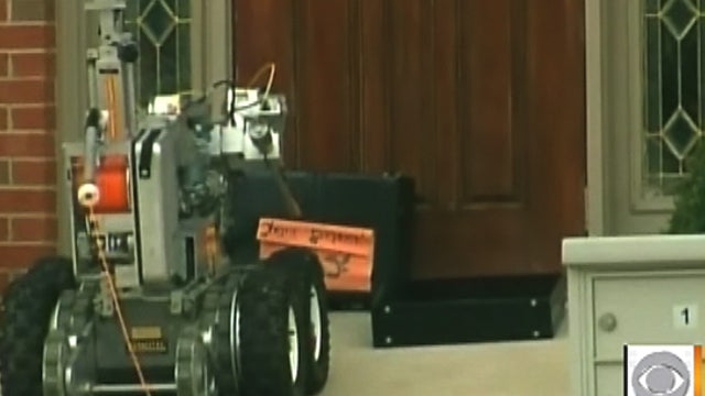 Robot that removed and blew up three briefcases left outside West Chester, Ohio office of House Speaker John Boehner. Authorities were investigating the bomb scare. Only papers were inside the briefcases. 