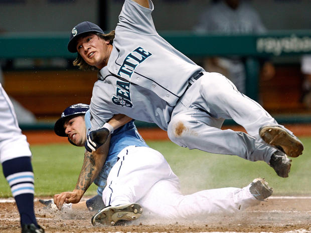 Matt Joyce, below, is tagged out by Mariners relief pitcher Dan Cortes while trying to score on a wild pitch 